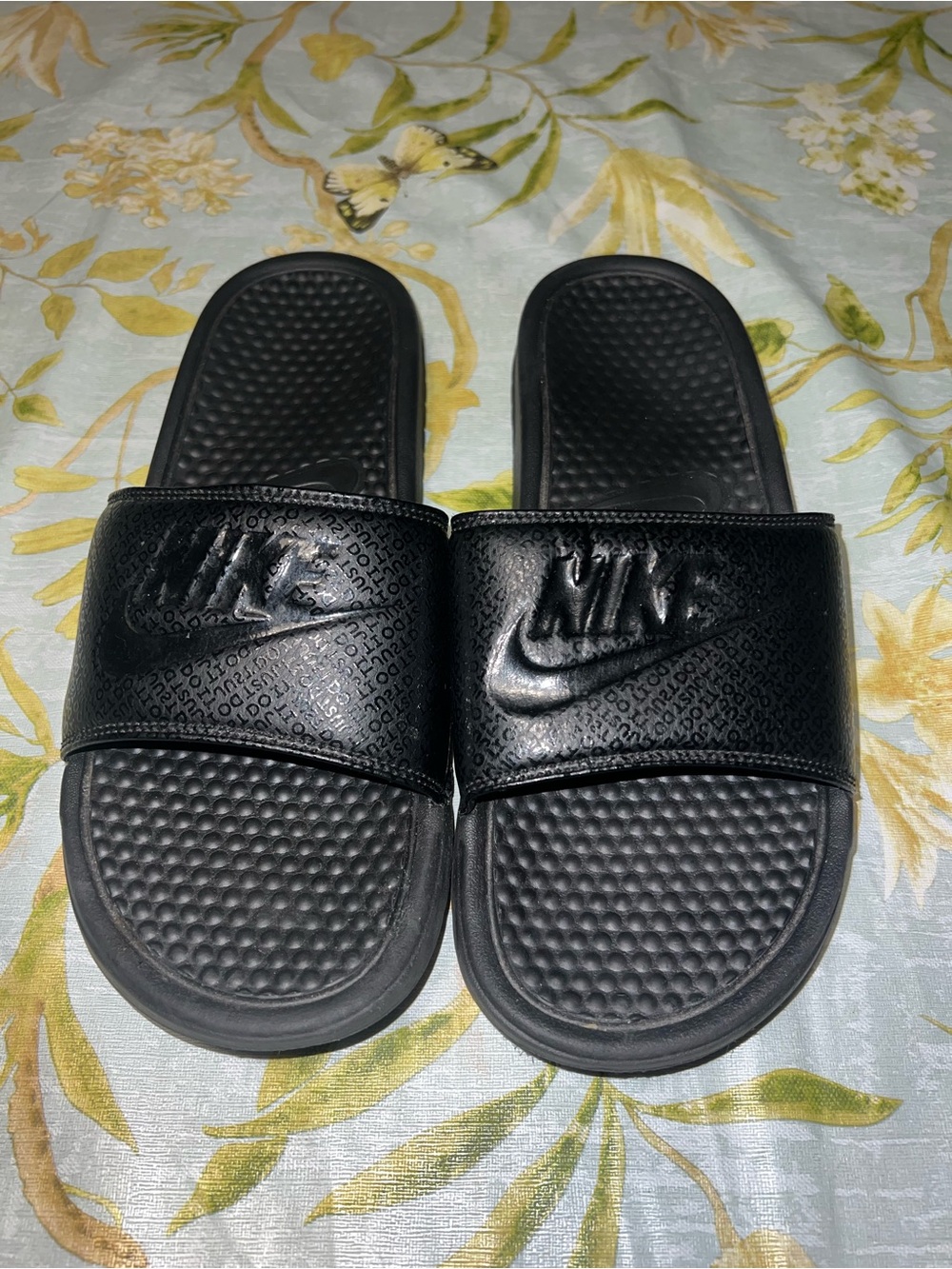Men's black Nike slides